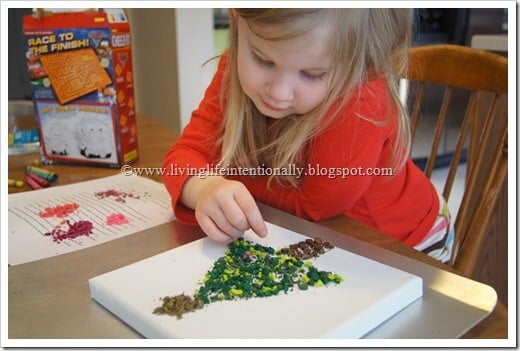 place broken crayon pieces on canvas place broken crayon pieces on canvas