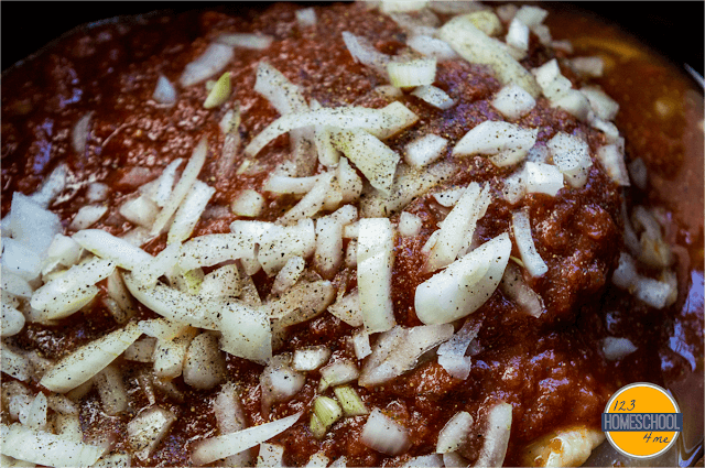 top with crushed tomatoes, garlic, onion, salt, pepper, and vinegar top with crushed tomatoes, garlic, onion, salt, pepper, and vinegar