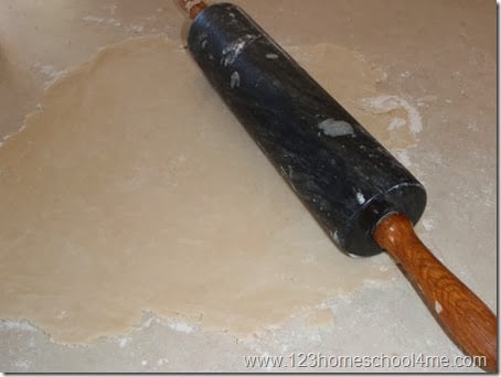 roll out pie crust on floured surface