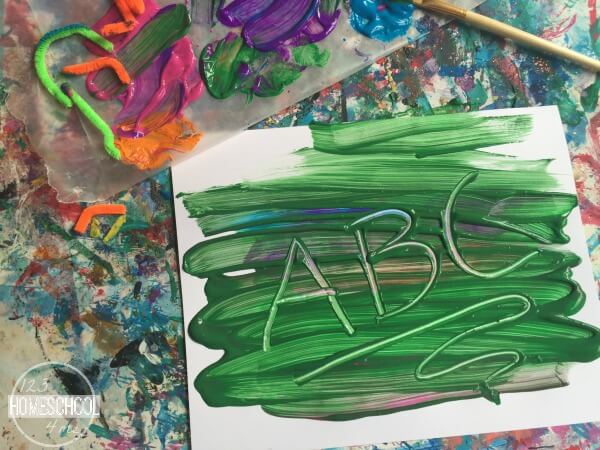 practice writing alphabet letters in the paint using a pipe cleaner practice writing alphabet letters in the paint using a pipe cleaner