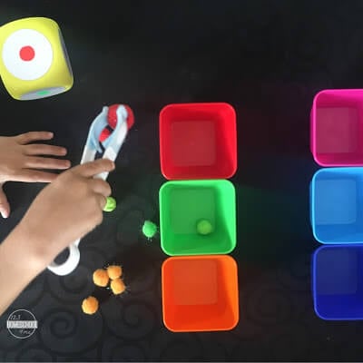 tongs and pom pom color sorting game for fine motor development tongs and pom pom color sorting game for fine motor development