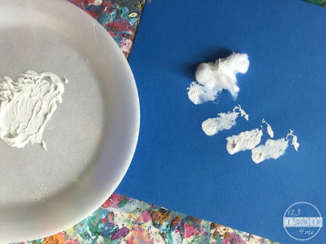 pour tempura paint on plate, dip cotton balls and make textured snow on construction paper pour tempura paint on plate, dip cotton balls and make textured snow on construction paper