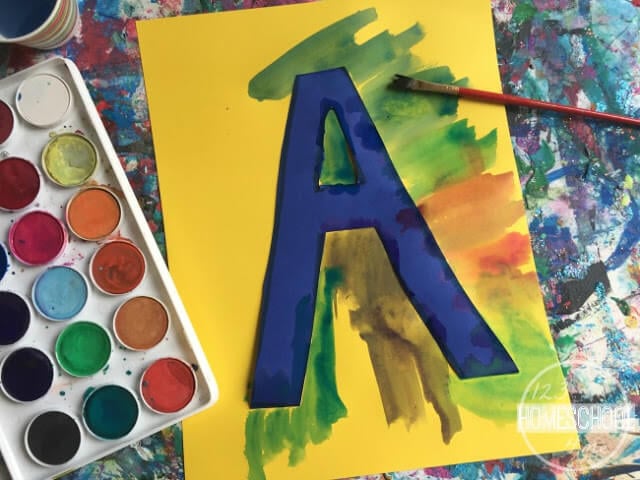 paint around the letter using watercolor paint paint around the letter using watercolor paint