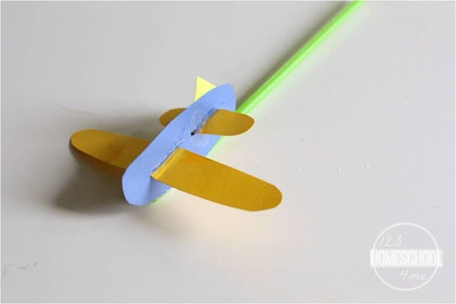assemble your construction paper pieces into a plane and affix to straw assemble your construction paper pieces into a plane and affix to straw