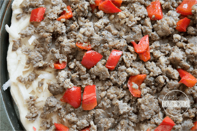 top with thawed, frozen potatoes, cooked ground sausage, and peppers top with thawed, frozen potatoes, cooked ground sausage, and peppers