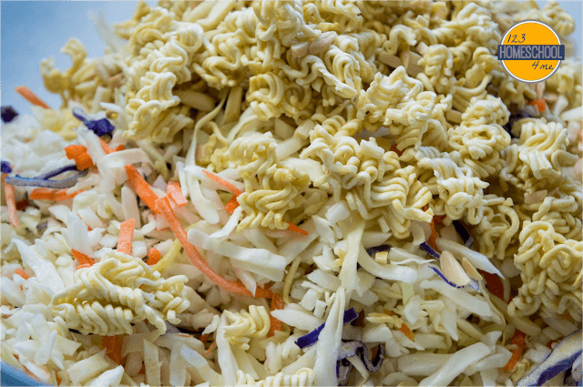 mix together coleslaw (cabbage and carrot) mixture and toss with toasted raman noodles and slivered almonds mix together coleslaw (cabbage and carrot) mixture and toss with toasted raman noodles and slivered almonds