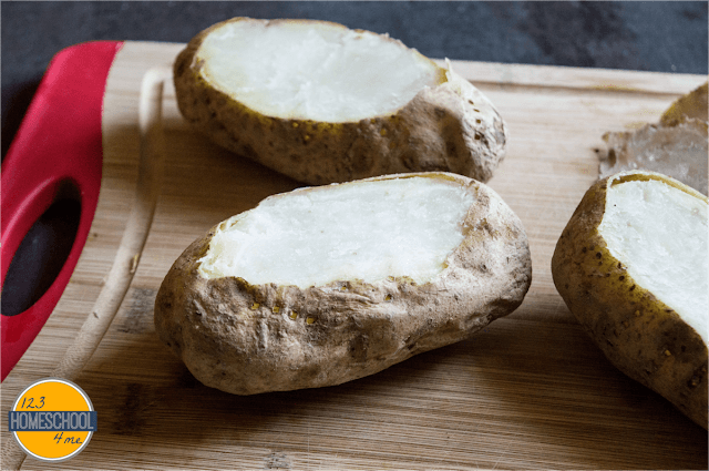 scoop out the inside of these baked potatoes scoop out the inside of these baked potatoes