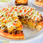 This homemade taco pizza is so simple to make and such a wonderful change from regular homemade pizza your family will eagerly request this pizza recipe again and again and again.