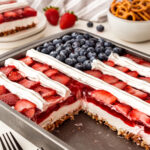 This yummy strawberry pretzel salad recipe is a delightuflly sweet and salty jello salad perfect for serving with hamburgers and more!