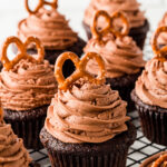 These chococolate cupcakes have such a lovely flavor profile with the hazelnut flour and yummy nutella frosting cupcakes! These moist, flavorful nutella cupcakes are the best homemade cupcake! Adults and kids alike will the salty crunch of the pretzel on top of these chocolate nutella cupcakes!