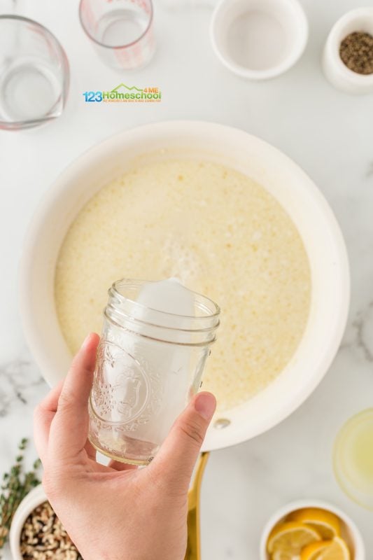 make creamy lemon sauce In the same pan, add the minced garlic to the delicious chicken drippings. If the pan looks a bit dry, don’t hesitate to drizzle in another tablespoon of oil. Sauté the garlic for about a minute, then pour in the chicken stock and milk. Let it come to a gentle simmer for 2 minutes, and then stir in the Parmesan cheese until it melts into a creamy sauce.
Next, grab a small container with a tight lid and shake together the cornstarch and 1/4 cup of water until well combined. Pour this mixture into the simmering sauce and stir until it thickens up nicely. To finish, add a splash of fresh lemon juice for that perfect bright flavor.