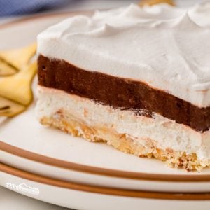 Treat yourself to a slice of heavenly Robert Redford dessert, featuring 4 layers of chocolate pudding, cream cheese, and whipped topping on a buttery nut crust!