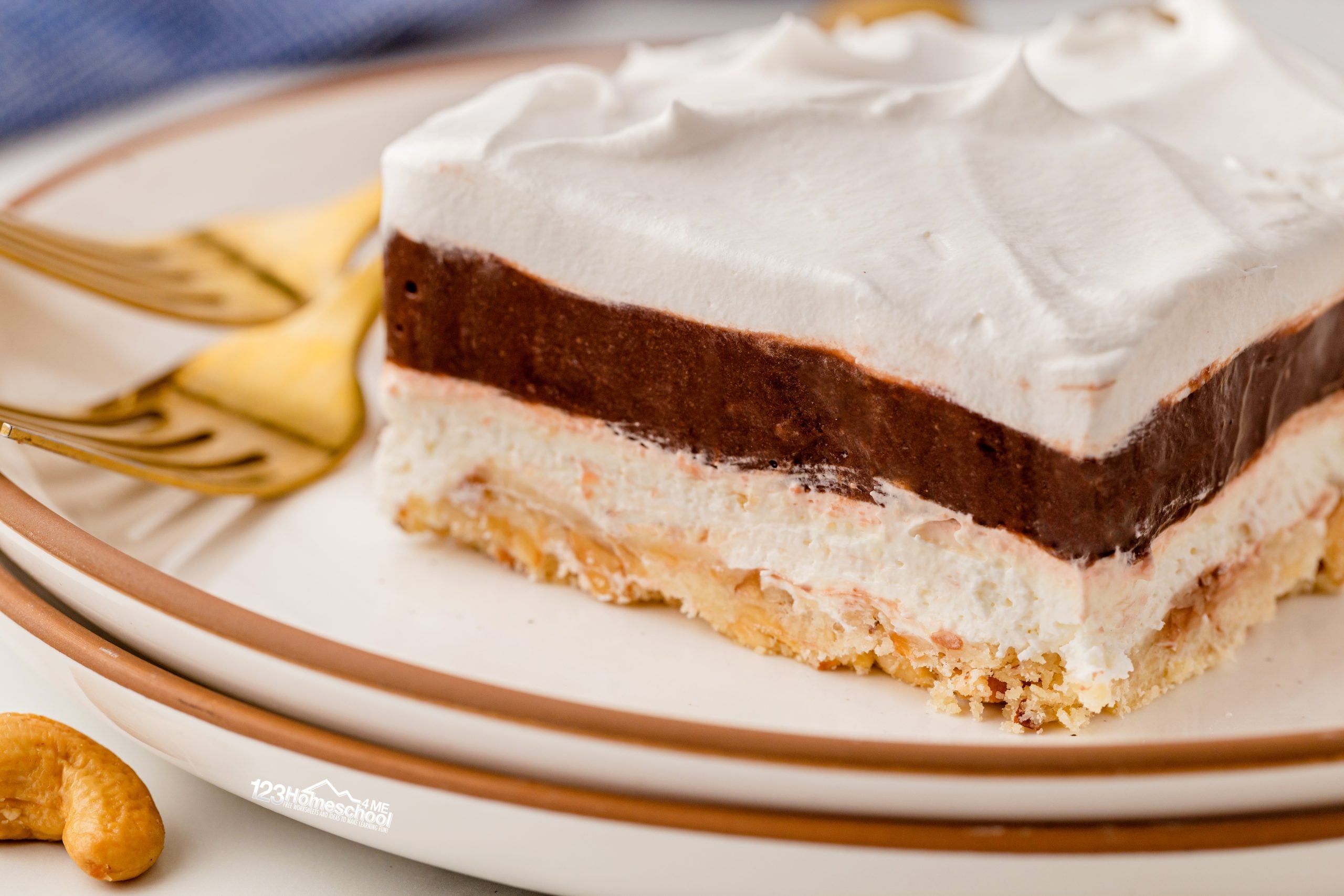 Treat yourself to a slice of heavenly Robert Redford dessert, featuring 4 layers of chocolate pudding, cream cheese, and whipped topping on a buttery nut crust!