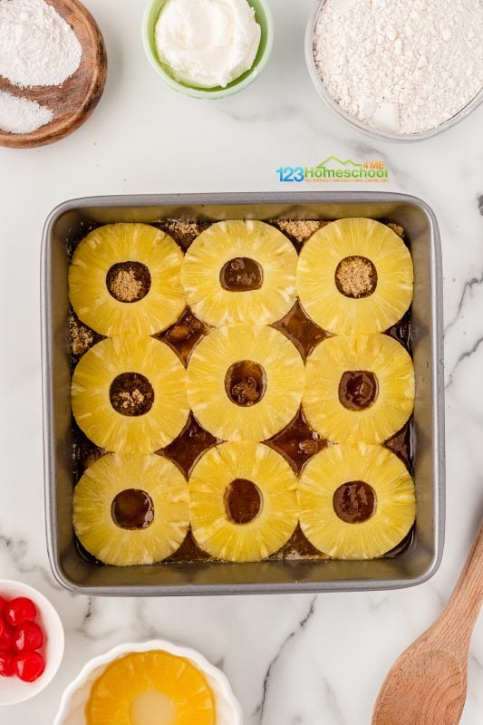 lay pineapple rings over the brown sugar