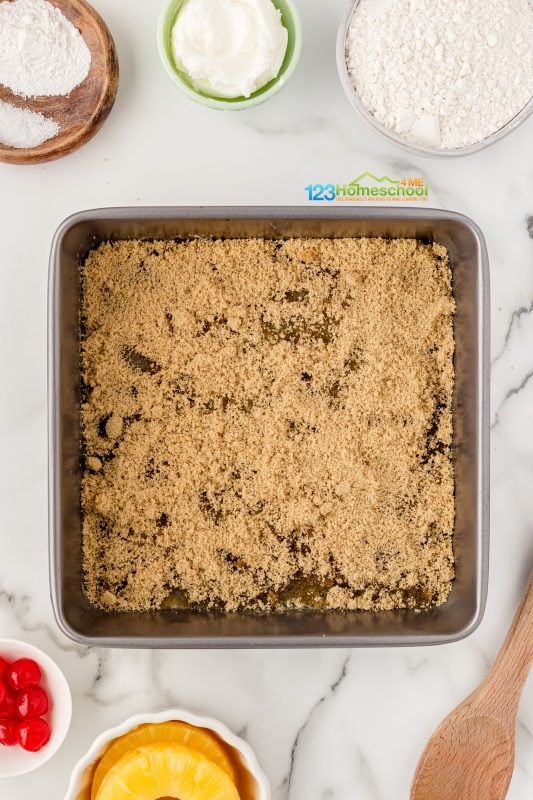 sprinkle brown sugar over melted butter in square pan