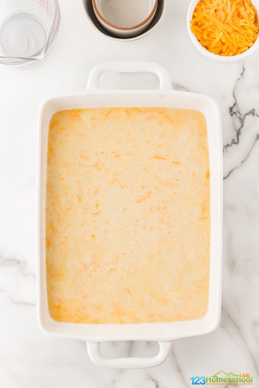Pour cornmeal into a greased 9x13-inch pan and spread it evenly to create a delicious bottom layer for your beef casserole! Beef Casserole