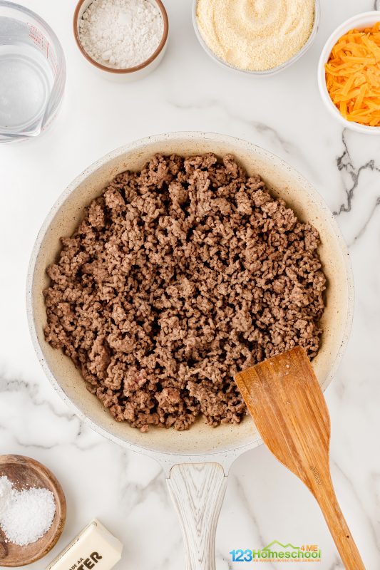 Start by browning 2 pounds of ground beef in a large skillet! Once it’s nicely browned, be sure to drain any excess fat. Beef Tamale Casserole