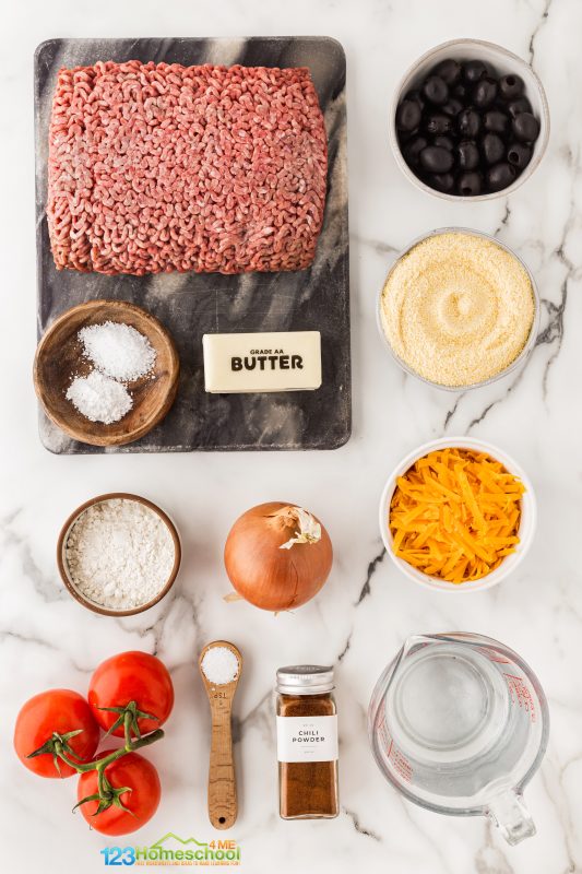 Beef Tamale Pie All you need to whip up this 30 minute dinner are a few ingredients:
ground beef
all purpose flour
onion
salt
tomato
baking powder
black olives
water
chili powder
butter
salt
cheddar cheese
cornmeal
