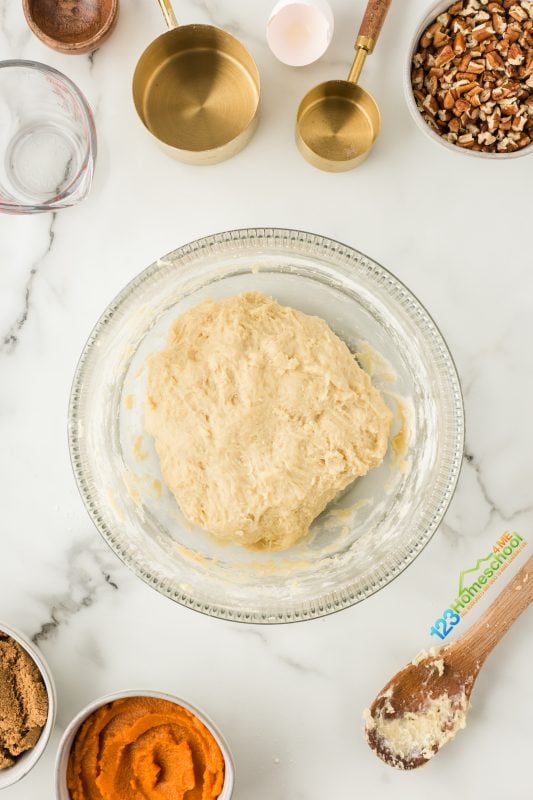 cover your bowl with a damp dish towel and place it in a warm spot for about 1 hour and 15 minutes. A great tip: I warm my oven to 200°F for just 3 minutes, then turn it off. While I mix the dough, I let the bowl rise in the cozy warmth of the oven. 
