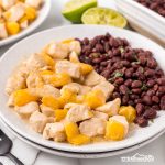 Satisfy your cravings with our Coconut Mango Chicken—a juicy, tropical delight that's easy to make and perfect with black beans and rice!