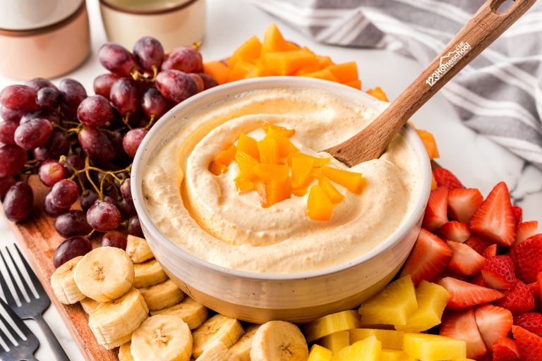 Elevate your fruit tray with this heavenly peaches and cream fruit dip—an outrageously delicious blend of cream cheese and marshmallow fluff!