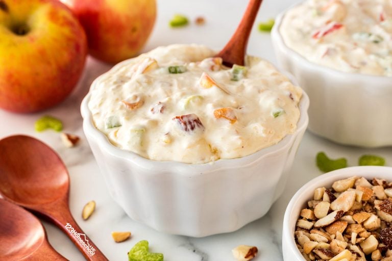 Try our delightful Autumn Apple Salad, a delicious jello side dish featuring lemon jello, pineapple, cream cheese, cool whip, and nuts—perfect for fall or any meal!