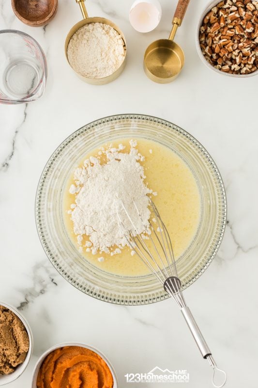 After the second rise of 45 minutes, preheat your oven to 375°F. Bake the rolls for 20 to 25 minutes or until they're beautifully golden brown!

While the rolls are in the oven, prepare a delicious glaze by whisking together powdered sugar and 2 to 3 tablespoons of maple syrup. Adjust the syrup to reach your desired glaze thickness.
