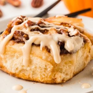 Get ready for fall with delightful Pumpkin Cinnamon Rolls topped with delicious maple icing for a tasty twist on a classic!
