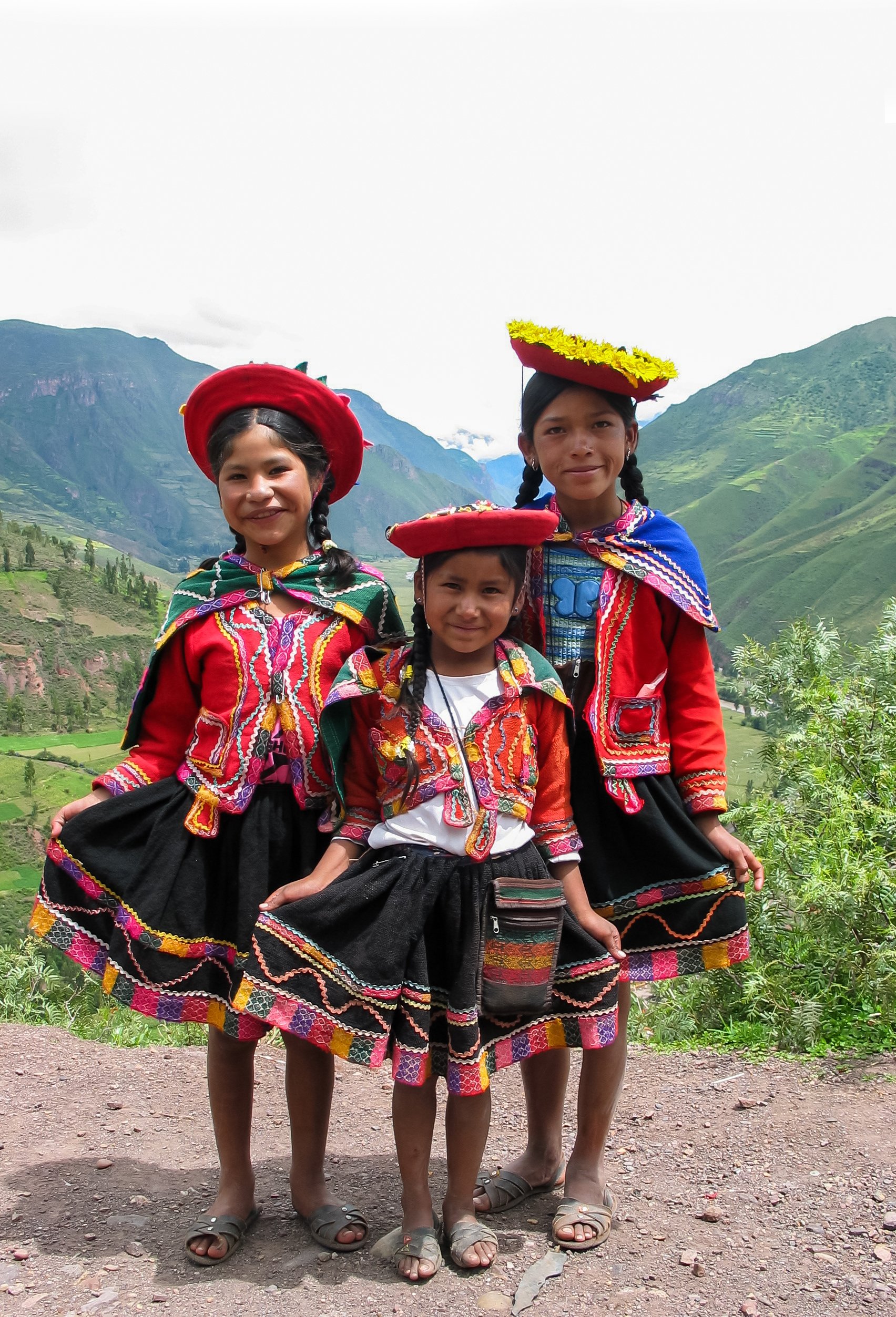 girls in traditional dresses from peru, a spanish speaking country in south america