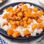 Try this easy pumpkin stir fry for dinner, packed with cashews, garlic, and orange juice for a delicious fall meal!