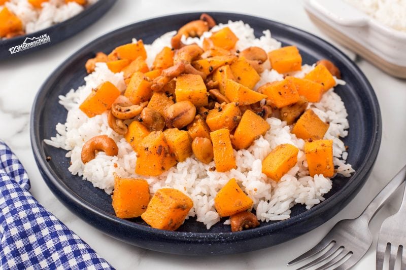 Try this easy pumpkin stir fry for dinner, packed with cashews, garlic, and orange juice for a delicious fall meal!