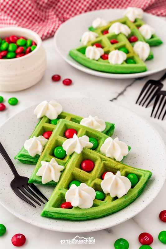 I wanted to share our fun Christmas waffles! We put green nautral food coloring in the batter. After they bake, I break them into triangles to make a Christmas tree. I put holiday red and green M&M in the goves and decorate with whipped cream. Often times I ad a sausage link trunk at the bottom too!