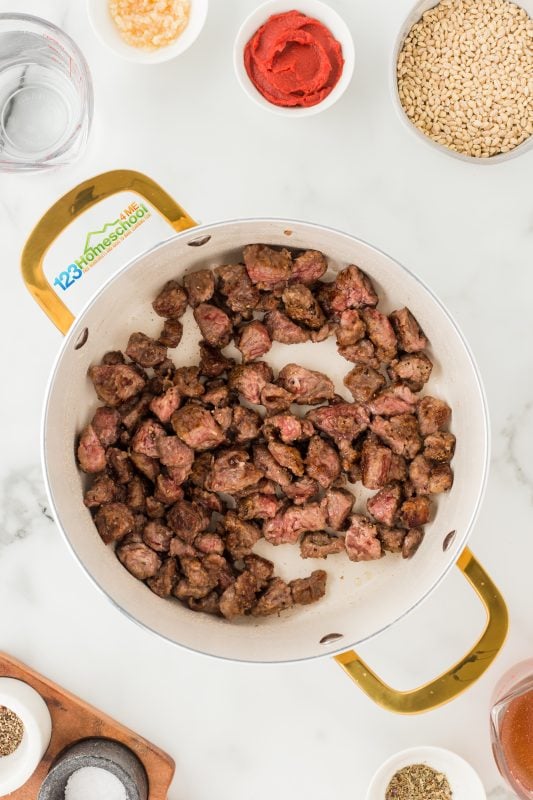 beef barley soup best recipe Start by heating some olive oil in a soup pot. Once it's nice and hot, add your beef and cook it until it's beautifully browned on all sides. After that, remove the beef from the pot and set it aside.