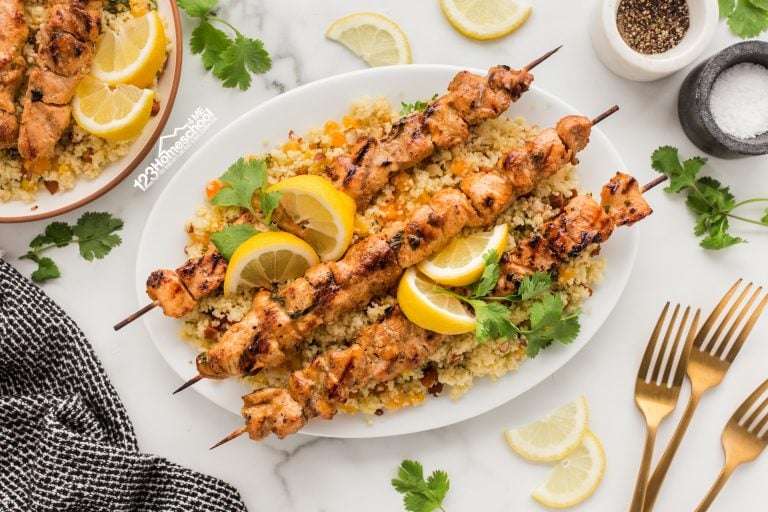 Embark on a delicious culinary adventure with this Moroccan chicken and couscous dish featuring juicy chicken, sweet apricots, crunchy almonds, and fresh cilantro!