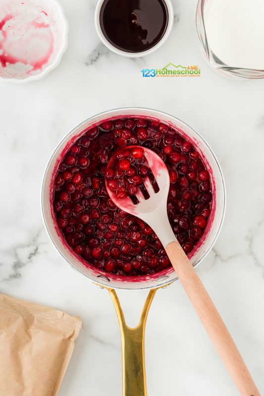 homemade cranberry sauce While your cakes are baking, it’s the perfect time to whip up some homemade cranberry sauce!
Start by combining sugar and cornstarch in a saucepan, stirring until there are no lumps. Next, add 1/2 cup of water along with fresh cranberries. Heat the mixture over medium-high until it reaches a gentle simmer, and watch as the cranberries begin to pop and release their vibrant color—this should take about 2 to 3 minutes.
Once the cranberries have popped, use a slotted spoon to transfer them to a heatproof bowl to cool. Leave the delicious sauce in the pan