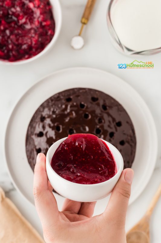 poke chcolate cake and pour cranberry sauce over the cake Next, gently drizzle the cranberry sauce (just the sauce, not the cooked cranberries) into the holes you made in the chocolate cake. It's a perfect way to add a burst of flavor!