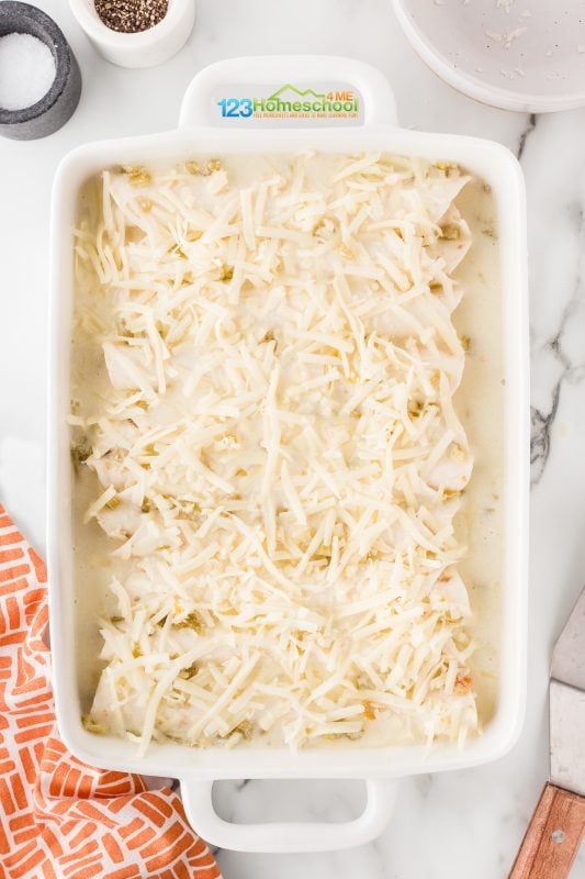 Chicken enchilada with sour cream white sauce Sprinkle a generous cup of shredded Monterey Jack cheese on top for a delicious finish!