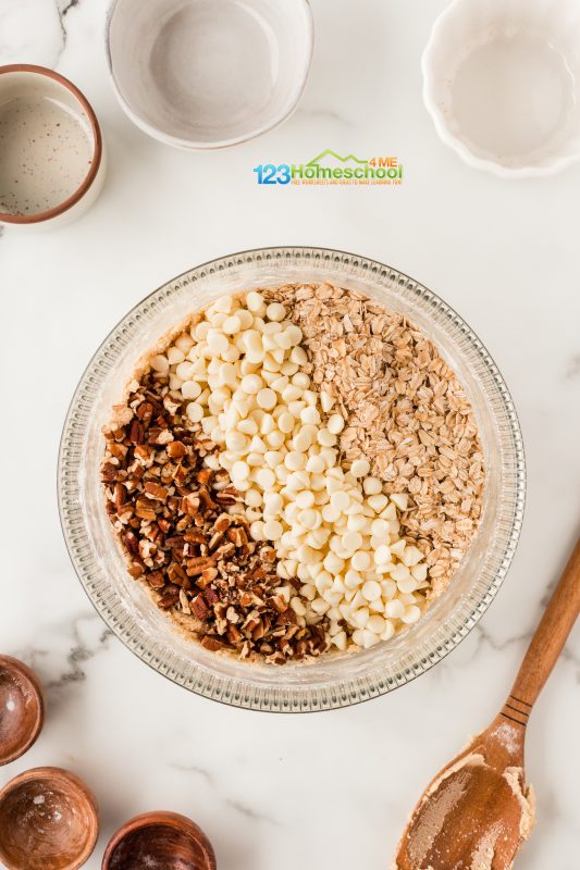 add pecans white choclate chips and rolled oats Mix in those rolled oats, delicious white chocolate chips, and crunchy pecans to bring everything together.