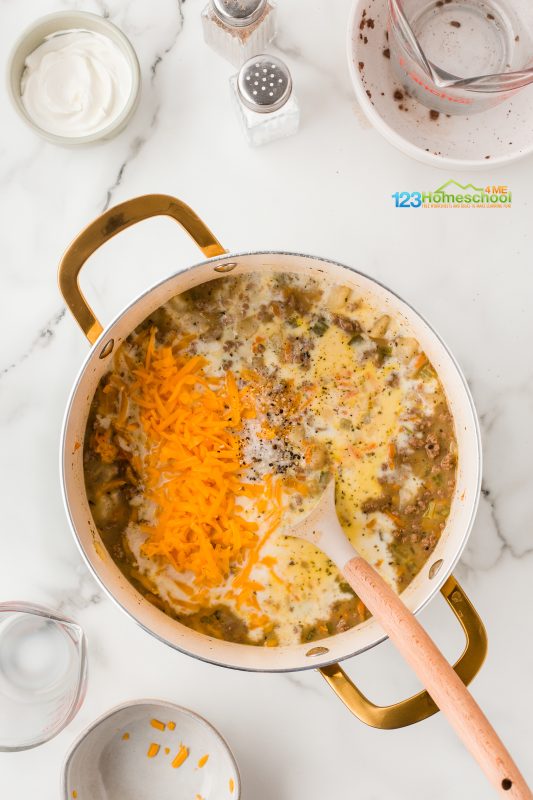 add milke and cheese Stir in sthe shredded cheese, milk, and salt and pepper. Keep cooking and stirring until that cheesy goodness melts into perfection!