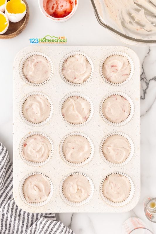 Strawberry and White Chocolate Cupcakes Time to get those cupcakes ready! Scoop the batter into your liners, filling them about two-thirds full. This way, you’ll prevent any messy spills while they bake.