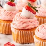 Get ready to indulge in the ultimate summer treat with these light and moist strawberry cupcakes topped with irresistibly delicious white chocolate strawberry frosting!