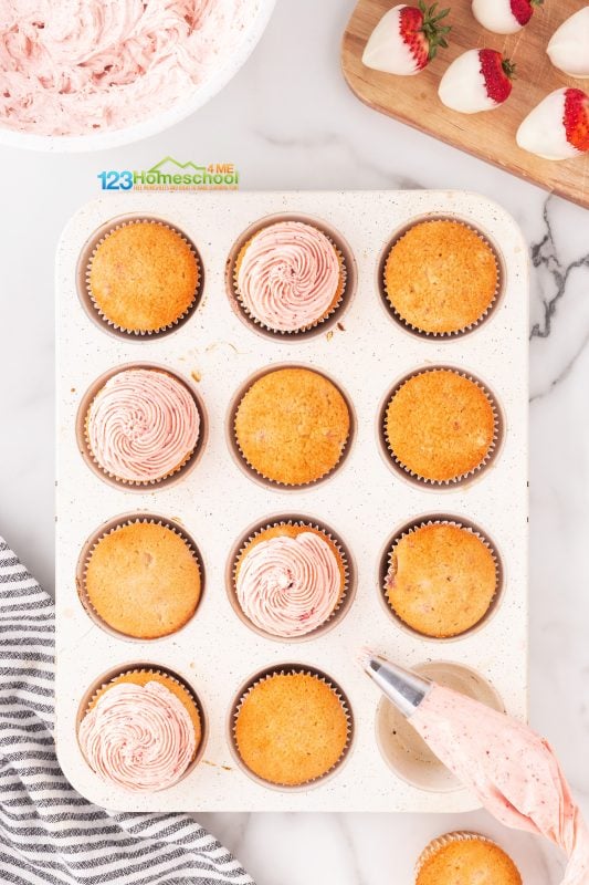 Strawberry frosting recipe Finally, it's time to bring these cooled cupcakes to life! Top each one with a dreamy, fluffy pink cloud of frosting that’s sure to impress.