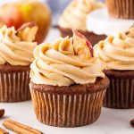 Savor the flavors of fall with delicious apple cupcakes topped with caramel icing, featuring a perfect blend of cinnamon and spice!