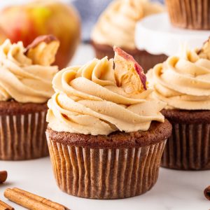 Savor the flavors of fall with delicious apple cupcakes topped with caramel icing, featuring a perfect blend of cinnamon and spice!