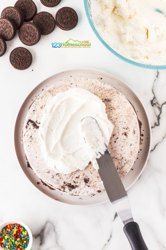 Best ice cream cake recipe Take it out of the freezer and generously spread a luscious layer of whipped cream on the top and sides for a smooth, delicious finish.
