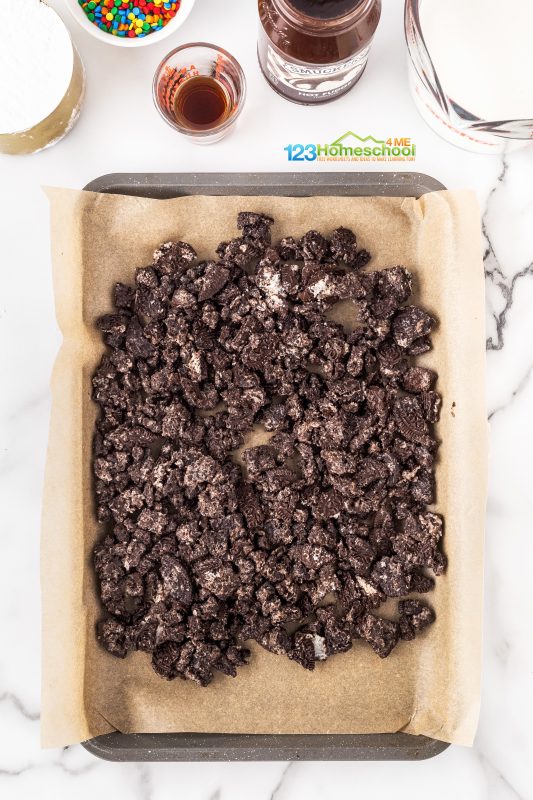 Dairy Queen ice cream cake recipe Crush up some Oreo cookies and combine them with melted butter. Press the mixture into a cookie sheet lined with parchment paper. Bake at 350°F for 8-10 minutes. Once baked, let it cool, then break it apart into smaller clumps. Set those delicious pieces aside for later!