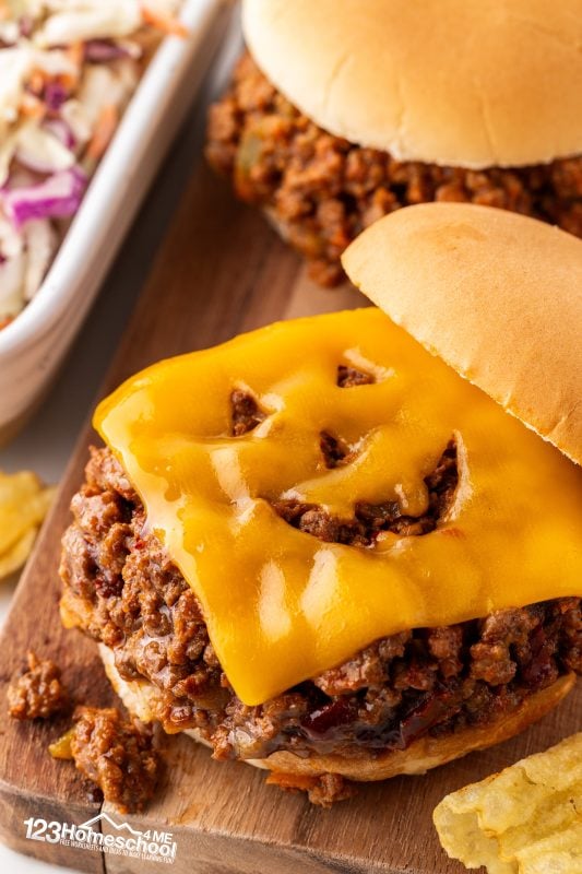 Halloween Dinner Ideas One of our favorite family traditions is enjoying sloppy joes on Halloween! I love getting creative by cutting silly faces out of cheddar cheese slices and placing them on top of the sandwiches. These adorable jack-o'-lanterns not only look festive but also taste amazing! Seeing my kids' smiles while they dig in makes it all the more special.