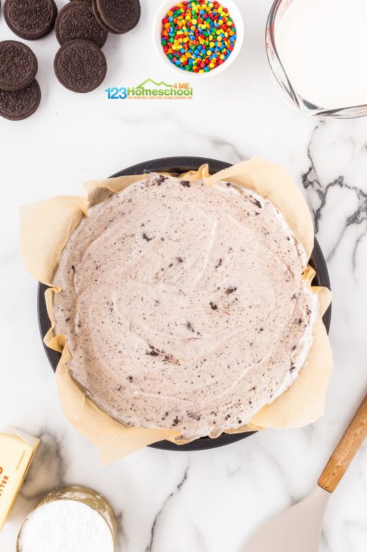 Icecream cake recipe Choose any two flavors you love—think classic chocolate and vanilla, or get creative with combos like chocolate and cookies & cream, or even chocolate and peppermint! I typically use about 1.5 quarts of each flavor.
First, line a 9" round cake pan with parchment paper. Scoop in one flavor of soft ice cream and smooth it out evenly.
Next, grab another identical 9" round pan, line it with parchment paper as well, and add your second flavor of ice cream, smoothing it out just like the first one. Cover both pans tightly with foil or plastic wrap, then pop them in the freezer for a couple of hours until they're solid.