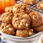 Indulge in the deliciousness of pumpkin white chocolate chip cookies made with healthy pumpkin, oats, pecans, and a blend of spices for a truly decadent treat!