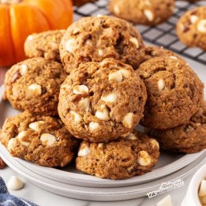 Indulge in the deliciousness of pumpkin white chocolate chip cookies made with healthy pumpkin, oats, pecans, and a blend of spices for a truly decadent treat!